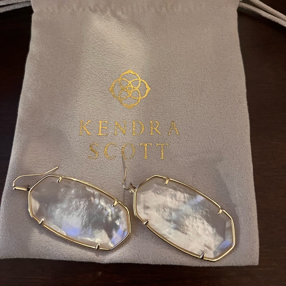 Kendra Scott, Mother of Pearl earrings.